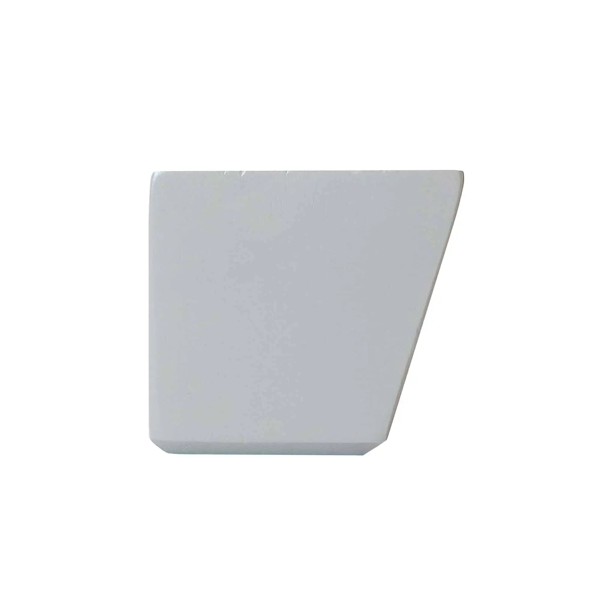 A smoke gray rectangular solid with one angled edge sits on a plain white background, resembling a modern litter box.